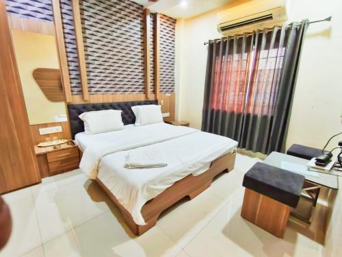 Postel nebo postele na pokoji v ubytování Hotel Amigo