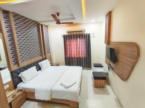 Postel nebo postele na pokoji v ubytování Hotel Amigo