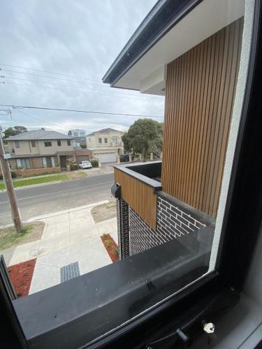 a view of a balcony with a view of a street at Springvale 3 Bedroom Town House - Best Location in Springvale