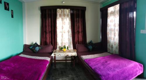 Ένα ή περισσότερα κρεβάτια σε δωμάτιο στο Neel DIGANTA HOME STAY, SILLERY GAON KALIMPONG