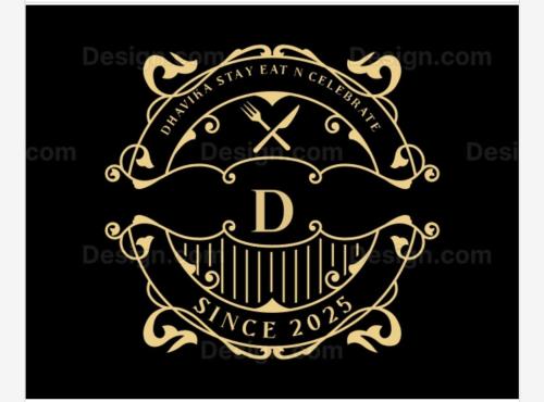 a gold frame with the letter d on a black background at Dhavika stay eat n celebrate in Jāmb