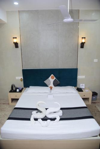 Postel nebo postele na pokoji v ubytování The Blue Lagoon Hotel Premium
