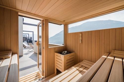 a sauna with a view of the mountains at Paloria Apartments & Sport in Lagundo