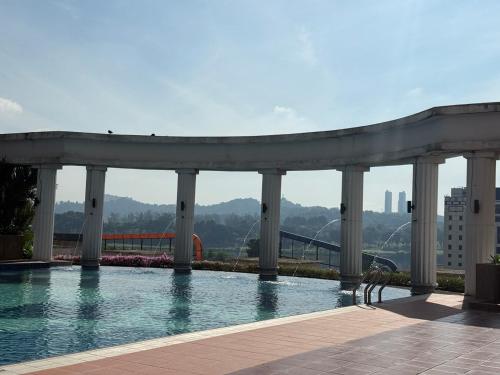 a swimming pool on top of a building at Cozy Stay -APU, Bukit Jalil, UPM in Serdang