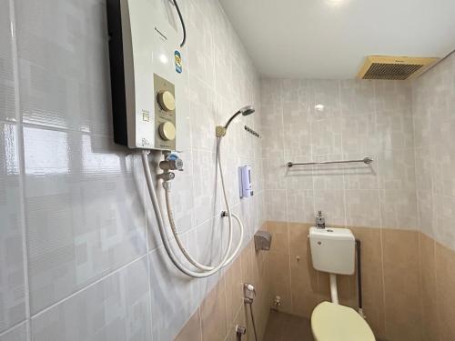 a bathroom with a shower and a toilet in it at Ipoh Comfortable Rooms Only-Private Bathrooms Indoor Car Parking SY30 in Ipoh