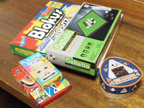 three boxes of games sitting on a table at 東京駅まで30分 日本の囲炉裏 1棟貸切 16名 130平米 2バスルーム パノラマビュー 桜 富士山 in Ichikawa