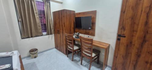 Μια τηλεόραση ή/και κέντρο ψυχαγωγίας στο Sunrise Service Apartment