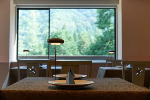 a table with a toy boat on top of it at Hotel Stelle Belle in Hakuba