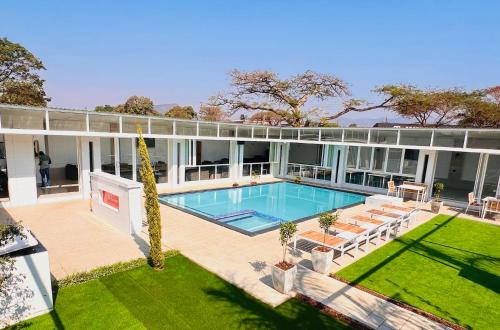an aerial view of a house with a swimming pool at Lamamie Suite Lodge in Thohoyandou
