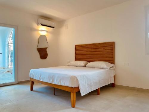 En eller flere senge i et værelse på Villa Regina