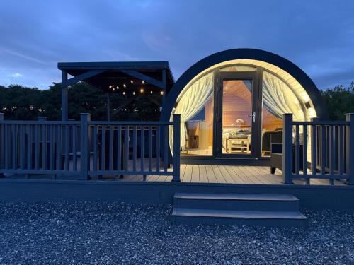 a gazebo with a glass door on a deck at Bockagh Farm in Ballaghaderreen