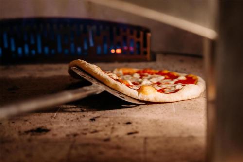 a pizza sitting inside of a pizza box at Grand Hyatt Singapore in Singapore