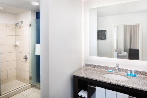 a bathroom with a sink and a shower at Hyatt House Charlotte Center City in Charlotte