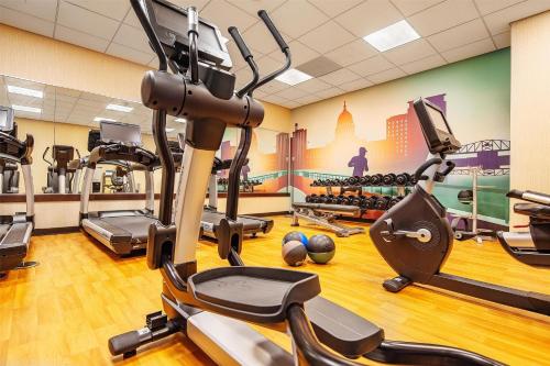 a gym with treadmills and cardio equipment in a gym at Hyatt Place Madison/Downtown in Madison