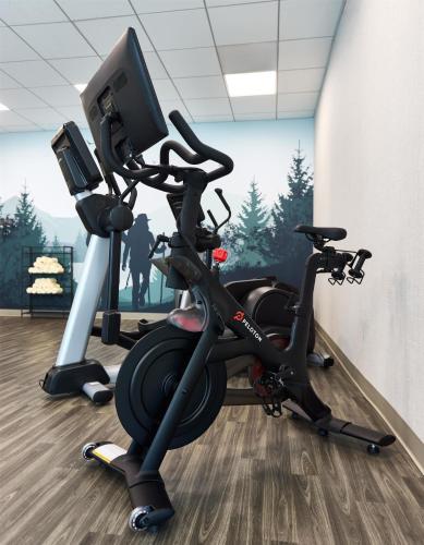 a gym with a exercise bike and a monitor at Hyatt Place Salt Lake City Downtown / The Gateway in Salt Lake City