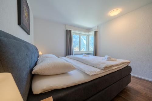 Residence Eden by Arosa Vacations, Exklusive Apartment im Zentrumにあるベッド
