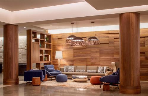 a living room with a couch and chairs at Hyatt Regency Lake Washington at Seattle's Southport in Renton