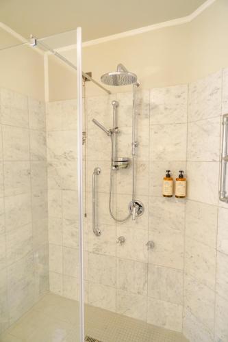 a bathroom with a shower with a glass door at Hotel San Luca in Spoleto