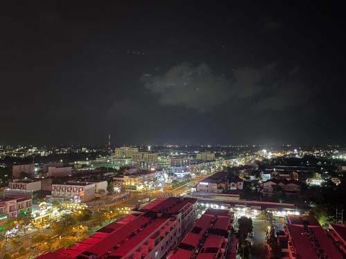a city at night with a lot of buses at Sophia Center - Serviced Apartment - Duke Hospitality in Rach Gia