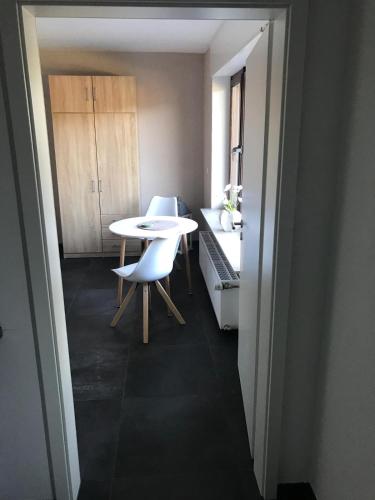 a small room with a table and chairs in it at Ferienwohnung Empt Vussem in Mechernich