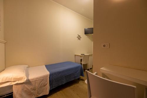Ένα ή περισσότερα κρεβάτια σε δωμάτιο στο Hotel Villa Edda