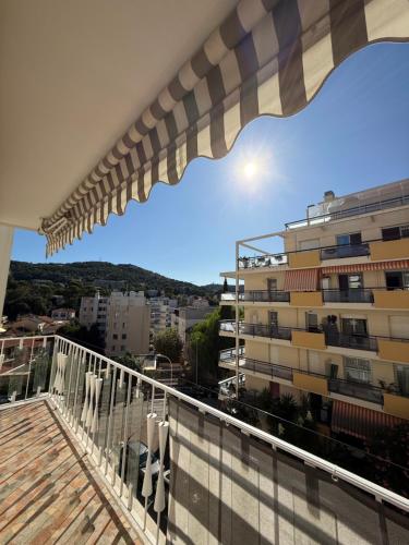 a balcony with a view of a building at Le Rubrent in Le Cannet