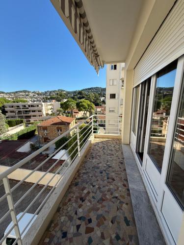 a balcony with a view of a building at Le Rubrent in Le Cannet