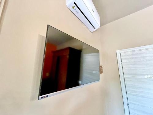 a large mirror on a wall in a room at CA'du LIN - Jacuzzi e Piscina in Cisterna dʼAsti
