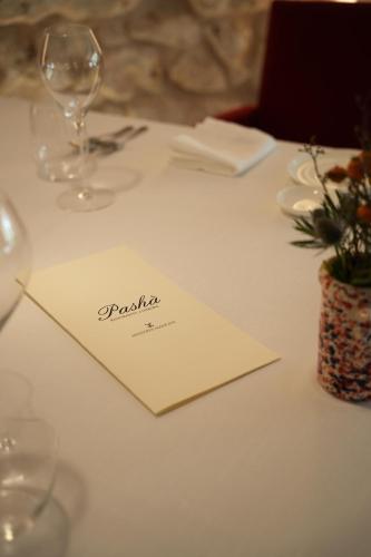 a table with a napkin and wine glasses on it at Masseria Mancini in Polignano a Mare
