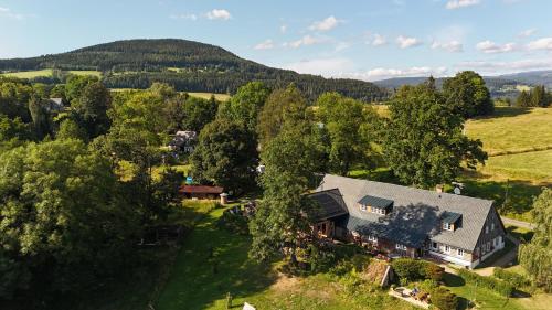an aerial view of a house in a field at Knežicka chalupa in Vrchlabí