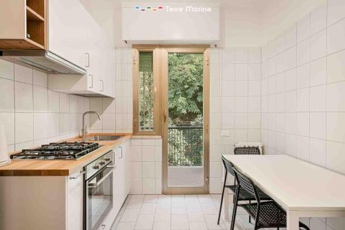 a kitchen with a sink and a stove top oven at Il Paguro, Terre Marine in Lerici