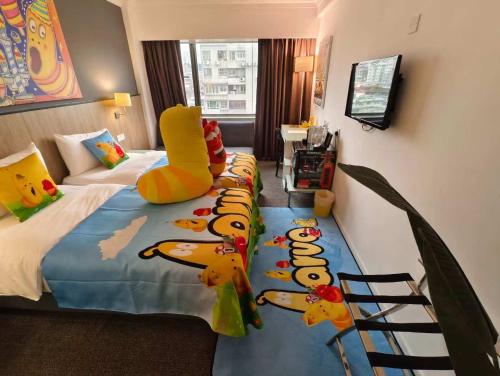 a hotel room with a bed with ducks on it at Macau Hotel S - Formerly - Macau Hotel Sun Sun in Macau