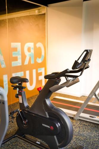 a exercise bike in a room with a wall at Macau Hotel S - Formerly - Macau Hotel Sun Sun in Macau