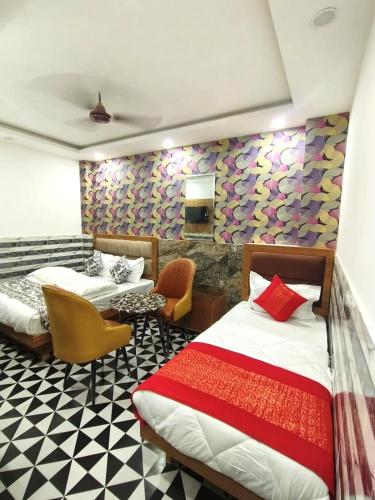 Ein Bett oder Betten in einem Zimmer der Unterkunft The Yuvaan Family hotel New Delhi Railway Station