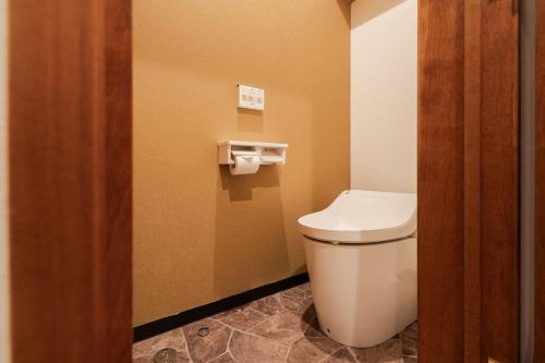 a bathroom with a white toilet in a room at The LOFT INN FUKUOKA in Fukuoka