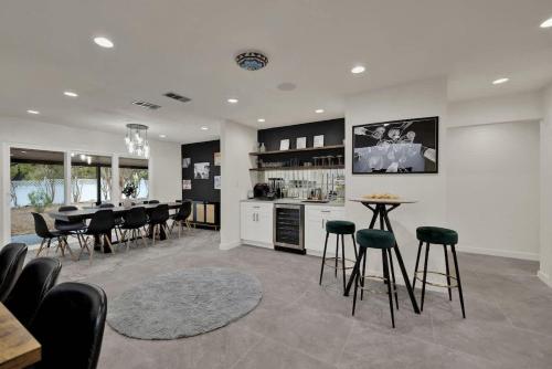 a kitchen and dining room with a table and chairs at Whitewater River House - Game Room, Firepit, Walking distance to Whitewater Amphitheater! in Sattler