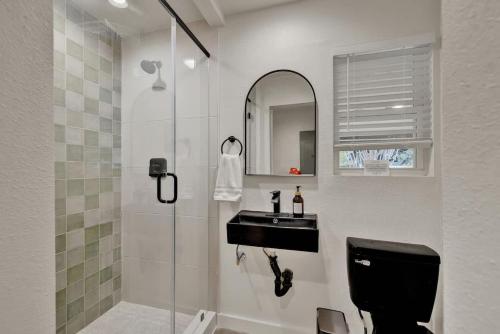 a bathroom with a toilet and a sink and a shower at Whitewater River House - Game Room, Firepit, Walking distance to Whitewater Amphitheater! in Sattler