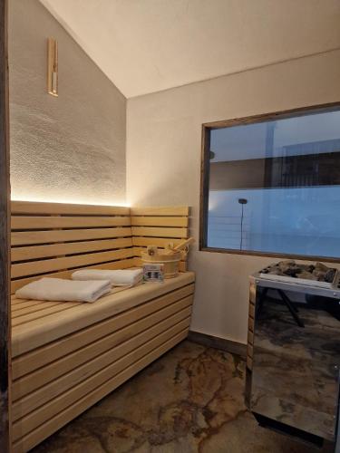 a small room with a bed and a window at Alpenchalet Vils Tirol in Vils