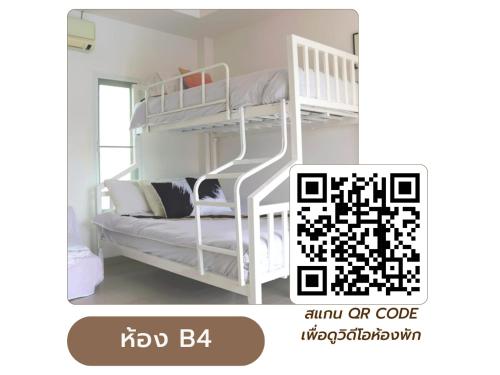 a white bunk bed in a white room at Home JANO in Cha Am