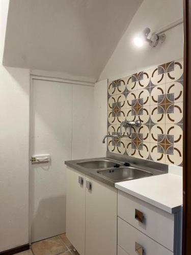 Una cocina o zona de cocina en Le Terre Gobe