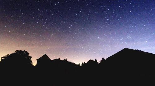a starry night with a silhouette of a mountain at Pure Gardères in Monlezun