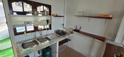 a kitchen with a sink and a counter top at House 2 Bedroom with Seaview in Baan Khai