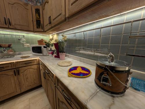 a kitchen with a slow cooker on a counter at Tango Violin in Cairo