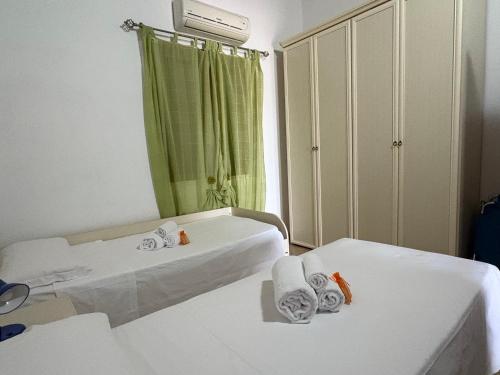 Ένα ή περισσότερα κρεβάτια σε δωμάτιο στο Villa Sofia Casa Vacanze
