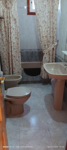 a bathroom with a toilet and a sink at "Old wall House, 2 dormitorios, Desayuno, Streaming, wiffi gratis in Olula del Río