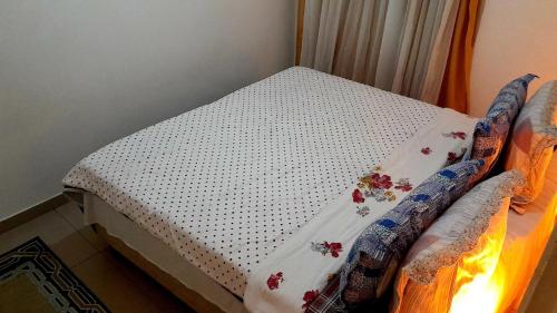 Postel nebo postele na pokoji v ubytování Hospedagem Domiciliar