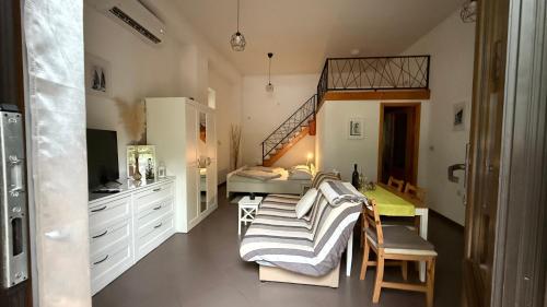 a room with a bedroom with a bed and a desk at Apartment Paolo in Senj