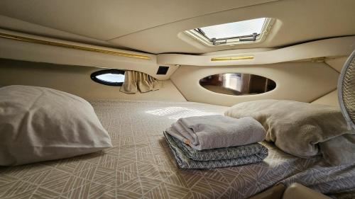 a room with two beds and a window in an airplane at Lisbon Boat Speedboat O Thor in Lisbon