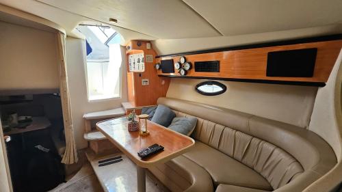 a living room with a couch and a table at Lisbon Boat Speedboat O Thor in Lisbon