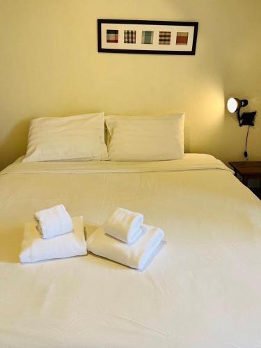 Postel nebo postele na pokoji v ubytování UDEE Cozy Hotel